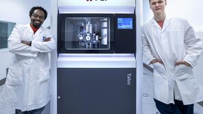 Two researchers at the TEM