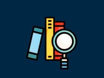 A magnifing glass focusing on some books