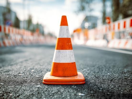 Road construction zone with safety cone and barrier barricades