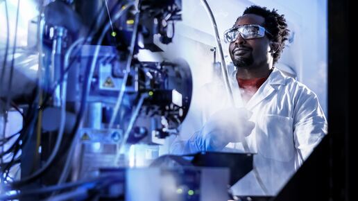 Researcher at a Transmission Electron Microscope